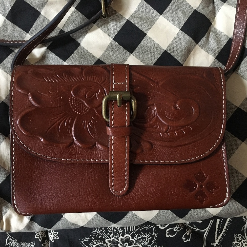 Tooled leather bag and wallet